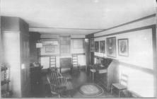 SA1405.18 - Unidentified room interior with desk, chair, cupboards, high chest of drawers, etc.